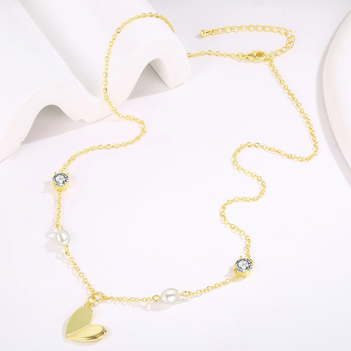 Freshwater pearl necklace with white cubic zirconia accents and a gold-tone heart pendant. - Zhefan Jewelry