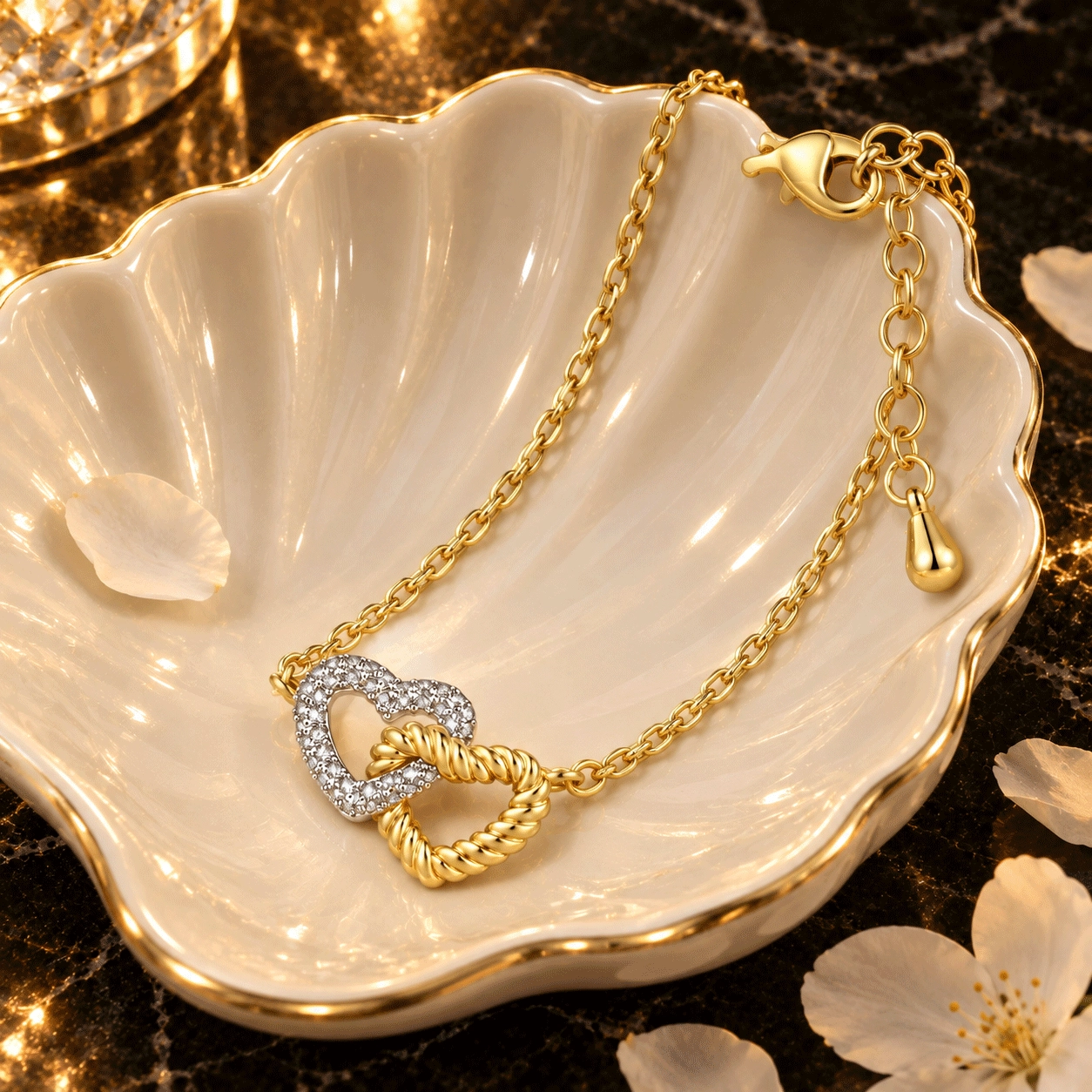 Heart necklace with interlocking double heart pendant and pav&eacute;-set cubic zirconia displayed in a jewelry styling scene
