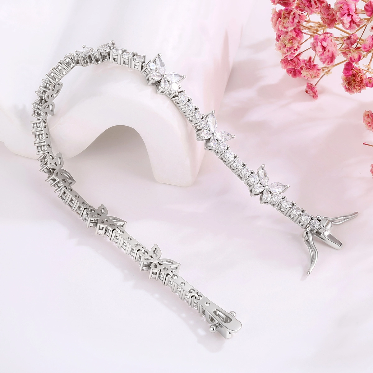 CZ tennis bracelet wholesale design with butterfly motifs and clear stones